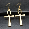 Vintage gold Ankh cross dangle earrings with a minimalist fishhook design on black background - Antique Gold