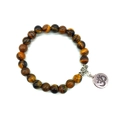 Detailed close-up of tiger eye stone bracelet with vintage silver Om charm and floral spacers - Tiger Eye