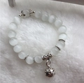 Cat eye stone bead bracelet with silver hollow ball pendant on soft white faux fur - 10mm / White