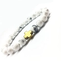 White turquoise yoga beads bracelet with polished gold metal cross pendant on white background - Gold