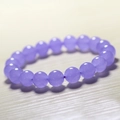 Macro detail of polished purple chalcedony beads with natural internal cloud textures - Lavender Chalcedony