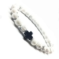 White howlite yoga bracelet with black cross charm on a clean white background - Gun Black