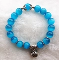 Elegant blue cat eye stone bead bracelet with vintage silver hollow bell charm - 10mm / Lake Blue