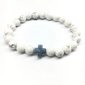 White howlite bead yoga bracelet featuring a dark grey metallic cross charm - Silver