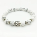 White turquoise Buddha head energy bead bracelet with silver-tone textured spacers - Howlite