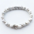 Detailed close-up of white howlite beads and silver Buddha head on elastic bracelet - White Turquoise