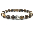 Tiger Eye stone bead bracelet with a silver Buddha head charm on a white background - Tiger Eye