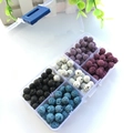 Top view of multi-colored lava stone beads set in a six-grid plastic organizer box - 40 Beads Per Color / Set 1