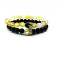 Detail of beaded couple bracelets with matte colorful glass beads and golden crowns - Yellow Combo