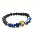 Black lava rock and imperial stone beaded bracelet with a golden lion head charm - Dark Blue Beads And Gold Lion Head