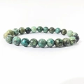 Macro shot of 8mm African turquoise beads with natural green and blue textures - African Turquoise