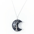 Detail of silver wire-wrapped Tree of Life on black obsidian moon-shaped pendant - Obsidian