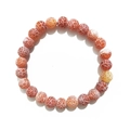 Macro detail of natural agate beads with unique white crackle patterns in orange-red - 8mm / Red Weathered Agate