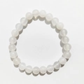 Macro detail of 8mm translucent milky white natural gemstone beads on a beaded bracelet - 8mm / Agate