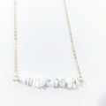 Detail of bohemian gold chain necklace with horizontal white turquoise stone pendant - Howlite