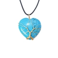 Macro detail of turquoise heart pendant with gold wire tree of life wrapping on black cord - Turquoise Style / 30x36mm