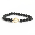 Elastic bracelet with black volcanic stone beads and a white resin sea turtle charm - Lava Stone with White Turtle