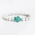 Handmade white marble beaded bracelet featuring a turquoise sea turtle charm - Synthetic White Turquoise with Blue Turtle