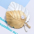 Detail of two-tone matte gold and silver leaf brooch with a white imitation pearl accent - Matte Silver and Gold