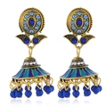 Macro detail of Bohemian enamel sun flower earrings with blue rhinestones and dangling beads - Royal Blue Antique Gold