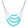 Détail d'un collier de perles bleu tiffany à quatre couches avec design superposé - Bleu Cyan