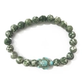 Elastic beaded bracelet with green turquoise stones and a detailed turtle pendant - Green Dot Stone