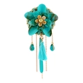 Detail of vintage flower brooch with cyan resin petals, gold chains, and silky tassel - Lake Blue