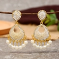Detailed view of hollow teardrop earrings with white enamel patterns and pearl tassels - White