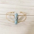 Detail of handmade gold wire-wrapped open cuff featuring a hexagonal blue turquoise stone - Blue Turquoise