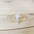 Handmade gold plated bangle with hexagonal opalite crystal on wooden background - Opal