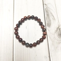 Macro view of 8mm red tiger eye stone beads showing natural cat-eye texture and luster - Red Tiger Eye