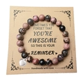 Natural amethyst and zebra stone heart bracelet on a vintage Kraft display card - Alloy Heart / Rhodonite