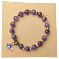 Goldenes Evil Eye Armband mit violetten Natursteinperlen und funkelnden Akzenten - Amethyst