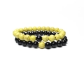 Détail macro de l'ensemble de bracelets extensibles en perles turquoise et onyx 8mm - 8mm / Turquoise Jaune Et Noir Brillant