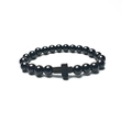 Close-up of polished black agate beads with a metallic cross charm on a beaded bracelet - Bright Black