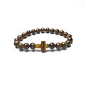 Detailed close-up of tiger eye beaded bracelet featuring a cross charm on white background - Tiger Eye