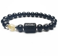 Macro del bracciale di perle nere con incisione a rinoceronte e perla traslucida - Toro / Perle da 8mm