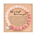 Detail of 8mm pink zebra stone beads with polished silver heart pendant on gift card - Rose Quartz And Rhodochrosite With Card