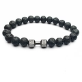 Detail of porous black lava stone beads with a metal dumbbell charm engraved with LIVE LIFT - Lava Stone (Gun Black)
