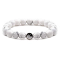 Yin Yang Tai Chi bracelet featuring white turquoise beads with marble texture - White Turquoise