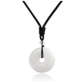 Close-up of a translucent white jade donut pendant necklace with black braided cord - White Crystal