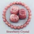 Macro detail of natural strawberry crystal beads and polished raw stones in pink hues - Imitation Strawberry Quartz
