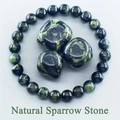 Natural Sparrow Stone beaded bracelet with matching polished stones on light background - Sparrow Stone