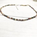 Macro shot of 4mm multi-color tourmaline beads necklace with silver lobster clasp detail - Circumference Approx: 38+5cm / India Agate