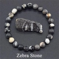 Elastic beaded bracelet featuring 8mm natural zebra stone beads with unique patterns - Zebra Jasper