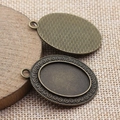Ovale 18x25mm Anhänger-Basis aus Bronze-Legierung mit verzierten Filigran-Details - Antikbronze