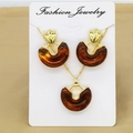 Detail view of amber resin half-moon necklace and earring set on jewelry card - Amber Geometric Style / Amber (FC172)