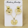 Close-up of golden geometric jewelry set with marble resin on white display card - Off-White (FC172)