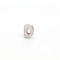 Detailed macro of silver-colored letter D charm with micro-paved sparkling zircon stones - DIY Letter Charm-D / Silver Rhinestone Letter D