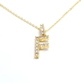 Detail of gold letter F pendant necklace paved with sparkling cubic zirconia stones - Letter F / Gold